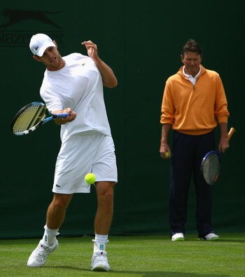 LONDON - JUNE 23:  Andy Roddick of the USA hits a forehand as his coach Jimmy Connors looks on while practicing during previews for the Wimbledon Lawn Tennis Championships at the All England Lawn Tennis and Croquet Club on June 23, 2007 in London, England