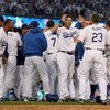 LOS ANGELES, CA - OCTOBER 08:  The Los Angeles Dodgers celebrate after Mark Loretta #5 hit a walk-off RBI to defeat the St. Louis Cardinals in Game Two of the NLDS during the 2009 MLB Playoffs at Dodger Stadium on October 8, 2009 in Los Angeles, Californi
