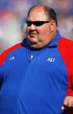 LAWRENCE, KS - SEPTEMBER 26:  Head coach Mark Mangino of the Kansas Jayhawks watches during warm-ups just prior to the start of the game against the Southern Mississippi Golden Eagles on September 26, 2009 at Memorial Stadium in Lawrence, Kansas.  (Photo 