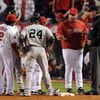 ANAHEIM, CA - OCTOBER 20:  Manager Mike Scioscia of the Los Angeles Angels of Anaheim questions a call with the third base umpire Tim McClelland after Mike Napol #44 (Not Shown) forced Jorge Posada #20 (Not Shown) of the New York Yankees at home plate dur