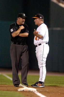BALTIMORE- SEPTEMBER 11:  Head coach Dave Trembley #47 of the Baltimore Orioles argues a call with first base umpire Dale Scott during the game against the Los Angeles Angels at Camden Yards September 11, 2007 in Baltimore, Maryland. (Photo by Greg Fiume/