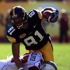 TAMPA, FL - JANUARY 01:  Tony Moeaki #81 of the Iowa Hawkeyes runs upfield as he fights off the tackle of Chris Culliver #17 of the South Carolina Gamecocks during the Outback Bowl on January 1, 2009 at Raymond James Stadium in Tampa, Florida.  (Photo by 