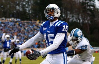 DURHAM, NC - NOVEMBER 29:  Receiver Eron Riley #15 of the Duke Blue Devils scores a touchdown past Quan Sturdivant #52 of the North Carolina Tar Heels during the game at Wallace Wade Stadium on November 29, 2008 in Durham, North Carolina.  (Photo by Kevin