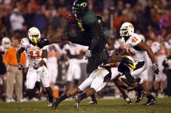 SAN DIEGO, CA - DECEMBER 30:   Runningback LeGarrette Blount #9 of the University of Oregon Ducks hurdles a player en route to a touchdown during his team's 42-31 win over the Oklahoma State University Cowboys in the Pacific Life Holiday Bowl at Qualcomm 