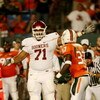 MIAMI GARDENS, FL - OCTOBER 3:  Offensive linesman Trent Williams #71 of the Oklahoma Sooners signals first down on a fake field goal attempt by Jarrett Brown #81 during the game on October 3, 2009 at Landshark Stadium in Miami Gardens, Florida. (Photo by