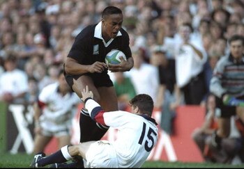 18 Jun 1995:  Jonah Lomu of New Zealand charges through the tackle of Mike Catt of England to score a try during the Rugby World Cup Semi Final at the Newlands Stadium in Cape Town, South Africa. New Zealand won the match 45-29.  \ Mandatory Credit: Ben R