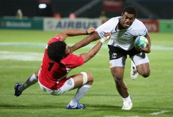 DUBAI, UNITED ARAB EMIRATES - MARCH 05:  Napolinoi Nalaga of Fiji is tackled during the Pool B match between Fiji and Georgia at the IRB Rugby World Cup Sevens 2009 at The Sevens stadium on March 5, 2009 in Dubai, UAE.  (Photo by Warren Little/Getty Image