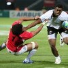 DUBAI, UNITED ARAB EMIRATES - MARCH 05:  Napolinoi Nalaga of Fiji is tackled during the Pool B match between Fiji and Georgia at the IRB Rugby World Cup Sevens 2009 at The Sevens stadium on March 5, 2009 in Dubai, UAE.  (Photo by Warren Little/Getty Image