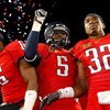 LAS VEGAS - DECEMBER 20:  Devon Ross #6, Nic Grigsby #5 and Nate Ness #32 of the Arizona Wildcats celebrate after the team's 31-21 victory over the Brigham Young University Cougars in the Pioneer Las Vegas Bowl at Sam Boyd Stadium December 20, 2008 in Las