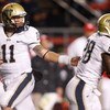 PISCATAWAY, NJ - OCTOBER 16: Bill Stull #11 hands the ball off to Dion Lewis #28 of the University of Pittsburgh Panthers against the Rutgers University Scarlett Knights on October 16, 2009 at Rutgers Stadium in Piscataway, New Jersey.  (Photo by Jared Wi