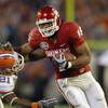MIAMI - JANUARY 08:  Jermaine Gresham #18 of the Oklahoma Sooners carries the ball against Major Wright #21 of the Florida Gators during the FedEx BCS National Championship Game at Dolphin Stadium on January 8, 2009 in Miami, Florida.  (Photo by Donald Mi