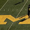 ANN ARBOR, MI - SEPTEMBER 19:  Michigan Wolverines players warm up for their game with the Eastern Michigan Eagles at Michigan Stadium on September 19, 2009 in Ann Arbor, Michigan.  (Photo by Stephen Dunn/Getty Images)