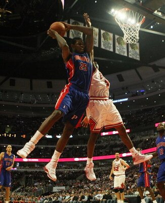 CHICAGO - MARCH 24: Amir Johnson #25 of the Detroit Pistons grabs a rebound over Ben Gordon #7 of the Chicago Bulls on March 24, 2009 at the United Center in Chicago, Illinois. The Bulls defeated the Pistons 99-91. NOTE TO USER: User expressly acknowledge