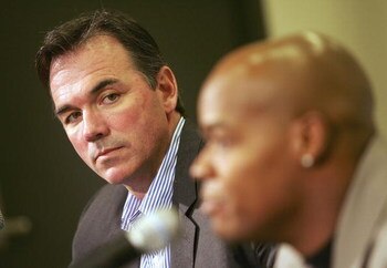 OAKLAND, CA - JANUARY 26:  General manager Billy Beane (L) of the Oakland Athletics listens to Frank Thomas speak during a press conference, after Thomas signed a one-year contract with the team, at McAfee Coliseum on January 26, 2006 in Oakland, Californ