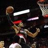 HOUSTON - APRIL 24:  Forward LaMarcus Aldridge #12 of the Portland Trail Blazers makes the slam dunk against Ron Artest #96 of the Houston Rockets in Game Three of the Western Conference Quarterfinals during the 2009 NBA Playoffs at Toyota Center on April