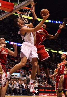 EAST RUTHERFORD, NJ - NOVEMBER 18:  Brook Lopez #11 of the New Jersey Nets attempts a layup against Ben Wallace #4 of the Cleveland Cavaliers at the Izod Center on November 18, 2008 in East Rutherford, New Jersey. NOTE TO USER: User expressly acknowledges
