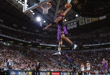 9 Mar 2001:  Vince Carter #15 of the Toronto Raptors makes a slam dunk during the game against the Seattle SuperSonics at the Key Arena in Seattle, Washington.  The Raptors defeated the SuperSonics 110-99.   NOTE TO USER: It is expressly understood that t