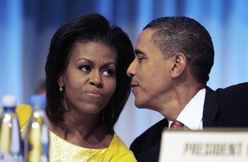 COPENHAGEN, DENMARK - OCTOBER 2:  U.S. President Barack Obama has a word with first lady Michelle Obama after they arrive to make a presentation in support of Chicago as the host city for the 2016 Summer Olympic Games on October 2, 2009 in Copenhagen, Den
