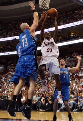 PHILADELPHIA - APRIL 26:  Lou Williams #23 of the Philadelphia 76ers drives to the hoop against Marcin Gortat #13 of the Orlando Magic during Game Four of the Eastern Conference Quarterfinals during the 2009 NBA Playoffs at the Wachovia Center on April 26