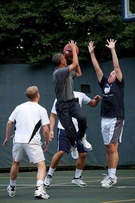WASHINGTON - OCTOBER 8:  In this handout photo provided by The White House, President Barack Obama takes a shot during a basketball game with cabinet secretaries and members of Congress on the White House basketball court, October 8, 2009 in Washington, D