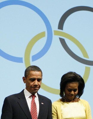 COPENHAGEN, DENMARK - OCTOBER 2:  U.S. President Barack Obama and first lady Michelle Obama leave the stage after they made a presentation in support of Chicago as the host city for the 2016 Summer Olympic Games on October 2, 2009 in Copenhagen, Denmark. 