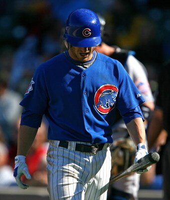 CHICAGO - AUGUST 30: Mike Fontenot #17 of the Chicago Cubs walks back to the dugout after striking out in the 9th inning against the New York Mets on August 30, 2009 at Wrigley Field in Chicago, Illinois. The Mets defeated the Cubs 4-1.(Photo by Jonathan 