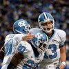 DURHAM, NC - NOVEMBER 29:  Quarterback T.J. Yates #13 of the North Carolina Tar Heels celebrates with running back Shaun Draughn #20 after Draughn's touchdown against the Duke Blue Devils during the game at Wallace Wade Stadium on November 29, 2008 in Dur