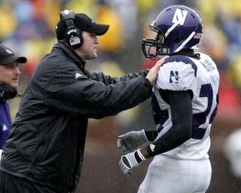 ANN ARBOR, MI - OCTOBER 28:  Head coach Pat Fitzgerald of the Northwestern Wildcats talks with Kevin Mitchell #24 during a game against the Michigan Wolverines on October 28, 2006 at Michigan Stadium in Ann Arbor, Michigan. Michigan defeated Northwestern 
