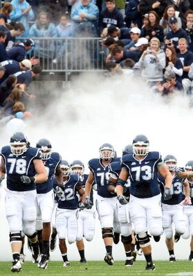 EAST HARTFORD, CT - SEPTEMBER 12:  The Connecticut Huskies enter the field before the game against  the North Carolinia Tar Heels on September 12, 2009 at Rentschler Field in East Hartford, Connecticut.  (Photo by Elsa/Getty Images)