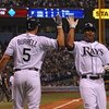 ST. PETERSBURG, FL - APRIL 13: Outfielder Carl Crawford #13 of the of the the Tampa Bay Rays celebrates a score with designated hitter Pat Burrell #5 against the New York Yankees April 13, 2009 in St. Petersburg, Florida.  (Photo by Al Messerschmidt/Getty