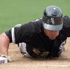 CHICAGO - JUNE 17:  Scott Podsednik #22 of the Chicago White Sox slides to a base against the Chicago Cubs on June 17, 2009 at Wrigley Field in Chicago, Illinois. (Photo by Jonathan Daniel/Getty Images)