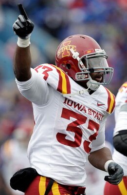 LAWRENCE, KS - OCTOBER 10:  Running back Alexander Robinson #33 of the Iowa State Cyclones celebrates after scoring a touchdown during the game against the Kansas Jayhawks on October 10, 2009 at Memorial Stadium in Lawrence, Kansas.  (Photo by Jamie Squir