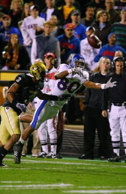 BOULDER, CO - OCTOBER 17: Dezmon Briscoe #80 of the Kansas Jayhawks reaches for a pass against Jimmy Smith #3 of the Colorado Buffaloes at Folsom Field on October 17, 2009 in Boulder, Colorado. (Photo by Garrett W. Ellwood/Getty Images)