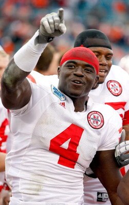 JACKSONVILLE, FL - JANUARY 1:  Larry Asante #4 of the Nebraska Cornhuskers celebrates a victory following the Konica Minolta Gator Bowl against the Clemson Tigers at Jacksonville Municipal Stadium January 1, 2009 in Jacksonville, Florida.  (Photo by Sam G
