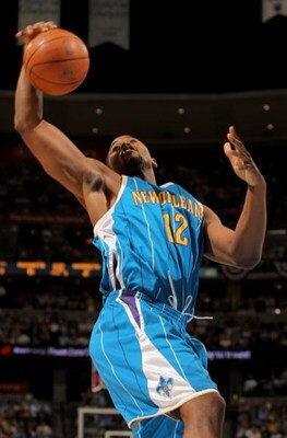 DENVER - APRIL 29:  Hilton Armstrong #12 of the New Orleans Hornets grabs a rebound against the Denver Nuggets in Game Five of the Western Conference Quarterfinals during the 2009 NBA Playoffs at Pepsi Center on April 29, 2009 in Denver, Colorado. The Nug