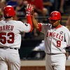 ARLINGTON, TX - JULY 1:  Bobby Abreu #53 and Chone Figgins #9 of the Los Angeles Angels of Anaheim celebrate after scoring against the Texas Rangers in the seventh inning at Rangers Ballpark July 1, 2009 in Arlington, Texas.  (Photo by Ronald Martinez/Get