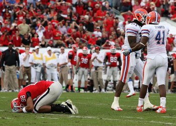JACKSONVILLE, FL - NOVEMBER 01:  Split end Kenneth Harris #88 of the Georgia Bulldogs reacts after missing a wide open catch in front of linebackers Ryan Stamper #41 and Brandon Spikes #51 of the Florida Gators at Jacksonville Municipal Stadium on Novembe
