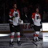 SUNRISE, FL - OCTOBER 16: Chris Pronger #20 and Mike Richards #18 of the Philadelphia Flyers stand during the playing of the national anthem prior to the game against the Florida Panthers on October 16, 2009 at the BankAtlantic Center in Sunrise, Florida.