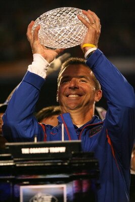 MIAMI - JANUARY 08:  Head coach Urban Meyer of the Florida Gators celebrates with the National Championship trophy after their 24-14 win against the Oklahoma Sooners during the FedEx BCS National Championship game at Dolphin Stadium on January 8, 2009 in 