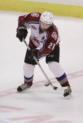 14 Apr 2001:  Peter Forsberg #21 of the Colorado Avalanche tries to center the puck against the Vancouver Canucks in the second period during game two of their first round playoff game at the Pepsi Center in Denver, Colorado. <DIGITAL IMAGE> Mandatory Cre