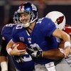 EAST RUTHERFORD, NJ - OCTOBER 25: Eli Manning #10 of the New York Giants is sacked in the second half by Alan Branch #78 of the Arizona Cardinals on October 25, 2009 at Giants Stadium in East Rutherford, New Jersey. (Photo by Jared Wickerham/Getty Images)