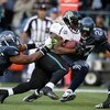 SEATTLE - OCTOBER 11:  Running back Maurice Jones-Drew #32 of the Jacksonville Jaguars rushes against Darryl Tapp #55 and Jordan Babineaux #27 of the Seattle Seahawks on October 11, 2009 at Qwest Field in Seattle, Washington. The Seahawks defeated the Jag