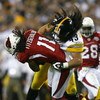 TAMPA, FL - FEBRUARY 01:  Larry Fitzgerald #11 of the Arizona Cardinals gets tackled by Troy Polamalu #43 of the Pittsburgh Steelers in the fourth quarter during Super Bowl XLIII on February 1, 2009 at Raymond James Stadium in Tampa, Florida.  (Photo by A