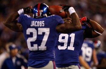 EAST RUTHERFORD, NJ - OCTOBER 25: Brandon Jacobs #27 celebrates with teammate Justin Tuck #91 of the New York Giants after Jacobs ran for a touchdown against the Arizona Cardinals on October 25, 2009 at Giants Stadium in East Rutherford, New Jersey. (Phot