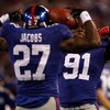 EAST RUTHERFORD, NJ - OCTOBER 25: Brandon Jacobs #27 celebrates with teammate Justin Tuck #91 of the New York Giants after Jacobs ran for a touchdown against the Arizona Cardinals on October 25, 2009 at Giants Stadium in East Rutherford, New Jersey. (Phot