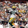 CLEVELAND, OH - OCTOBER 25:  Donald Driver #80 of the Green Bay Packers scores a touchdown in front of Brodney Pool #21 of the Cleveland Browns at Cleveland Browns Stadium on October 25, 2009 in Cleveland, Ohio.  (Photo by Matt Sullivan/Getty Images)