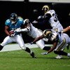 JACKSONVILLE, FL - OCTOBER 18:  Mike Thomas #80 of the Jacksonville Jaguars is tackled by Quincy Butler #36 of the St. Louis Rams during the game at Jacksonville Municipal Stadium on October 18, 2009 in Jacksonville, Florida.  (Photo by Sam Greenwood/Gett