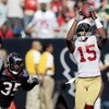 HOUSTON - OCTOBER 25:  Wide receiver Michael Crabtree #15 of the San Francisco 49ers catches a pass in the fourth quarter in front of cornerback Jacque Reeves #35 of the Houston Texans at Reliant Stadium on October 25, 2009 in Houston, Texas.  (Photo by B