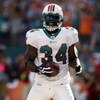MIAMI - OCTOBER 25:  Running back Ricky Williams #34 of the Miami Dolphins celebrates a touchdown run against the New Orleans Saints at Land Shark Stadium on October 25, 2009 in Miami, Florida.  (Photo by Doug Benc/Getty Images)