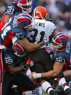 ORCHARD PARK, NY - OCTOBER 11:  Jairus Byrd #31, Aaron Schobel #94, Ashlee Palmer #59 and Chris Kelsay #90 of the Buffalo Bills gang tackle Jamal Lewis #31 of the Cleveland Browns during their NFL at Ralph Wilson Stadium on October 11, 2009 in Orchard Par